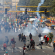 Police use tear gas to disperse the group of farmers.